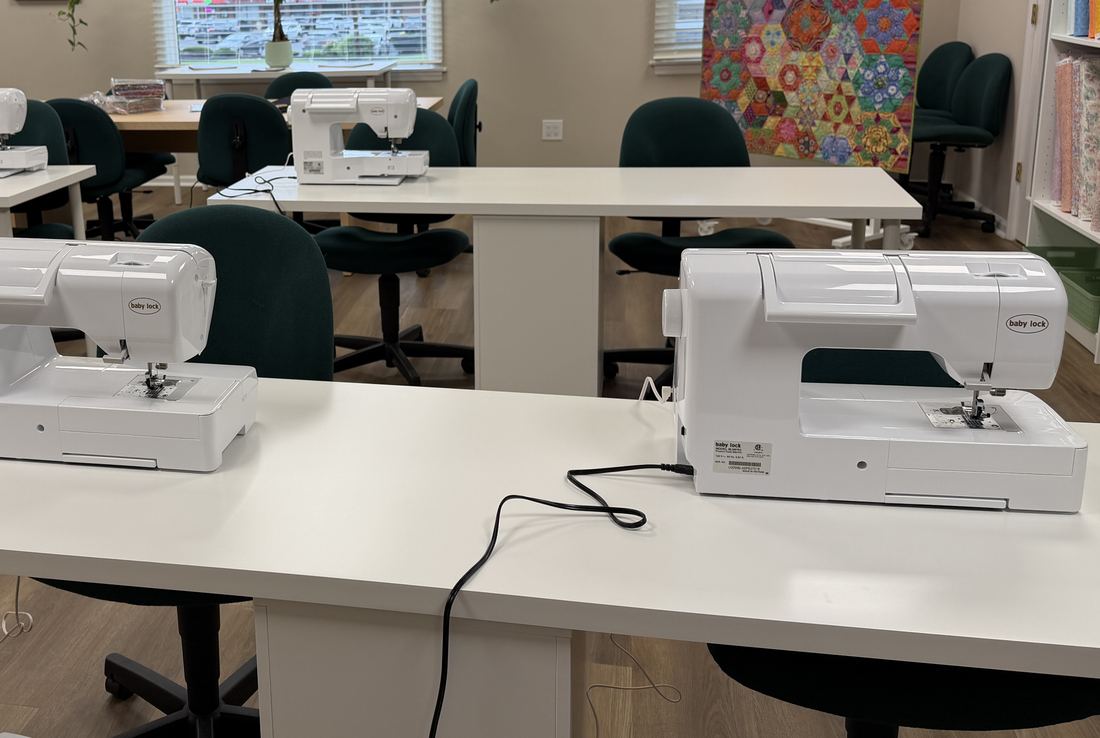 Baby Lock sewing machines lined up in the studio classroom
